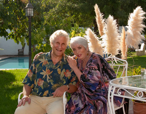 1.philip-and-xie-with-feathers-in-garden 1.philip-and-xie-with-feathers-in-garden
